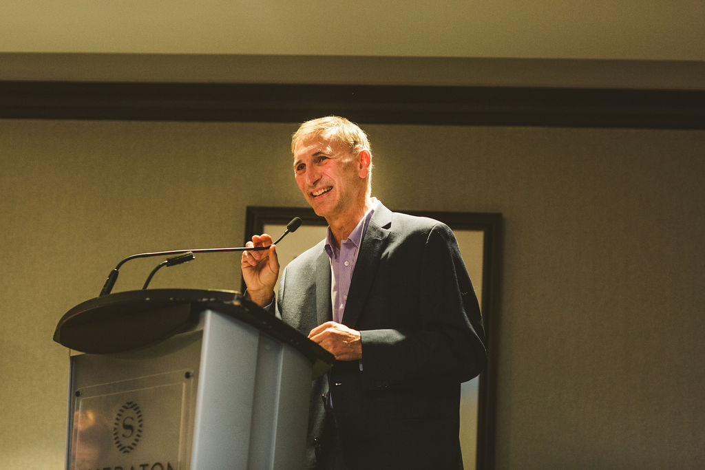 A photo of Tony Horava delivering a speech during the Ron MacDonald Award Ceremony.