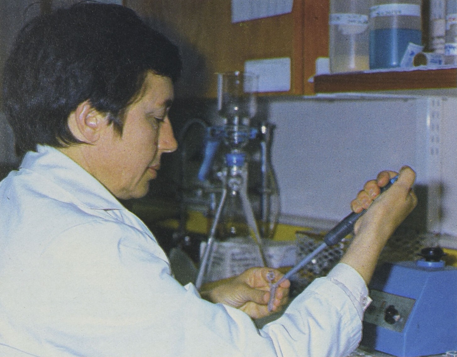 Dr. Jean Himms-Hagen using scientific equipment in a lab.